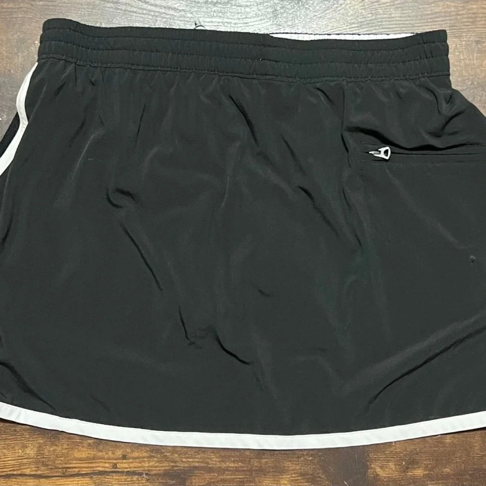 Brooks black running shorts with white side stripes 314.5